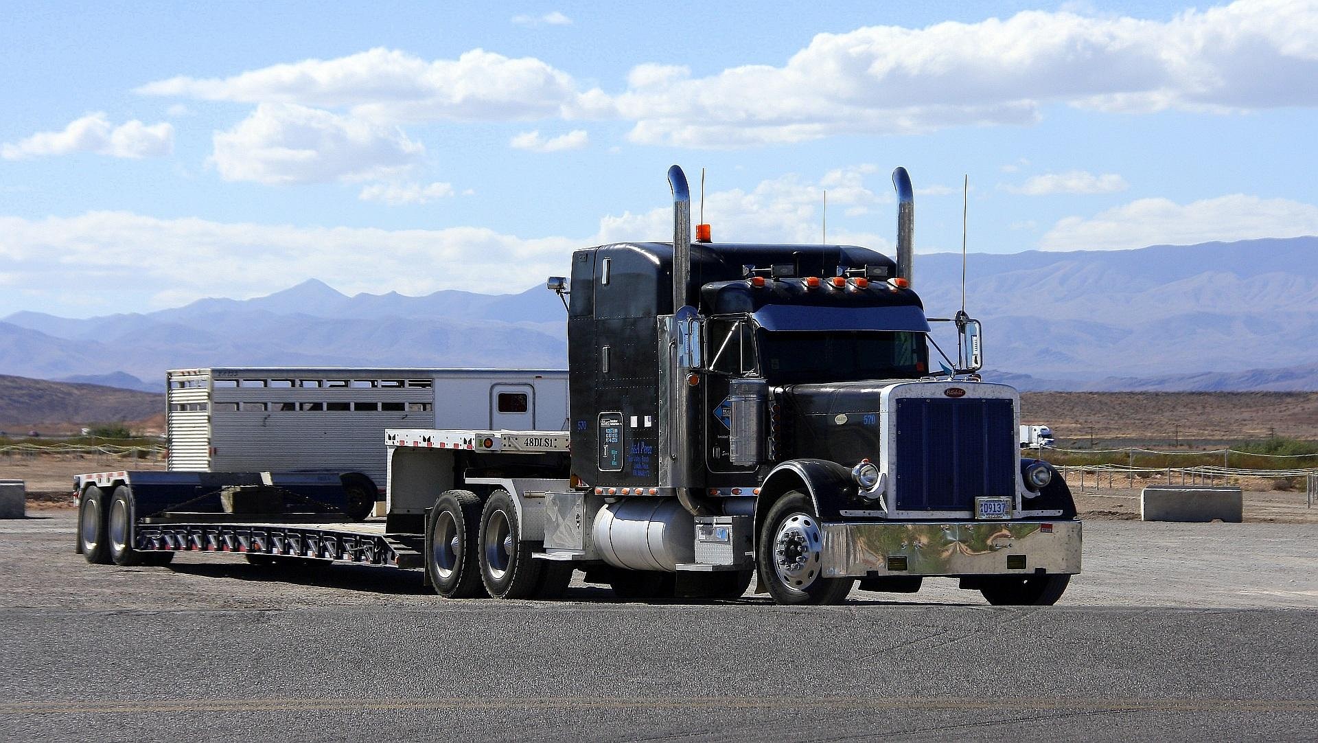 Semi truck and trailer driving on an open road